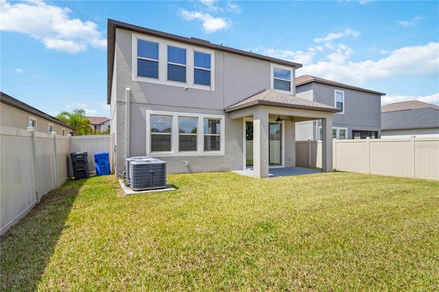 9629 Ivory Dr, Ruskin, FL 33573 - rear view of property featuring stucco siding, a patio, a ceiling fan, and a fenced backyard