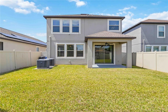 9629 Ivory Dr, Ruskin, FL 33573 - rear view of house with stucco siding, ceiling fan, a fenced backyard, and a patio area