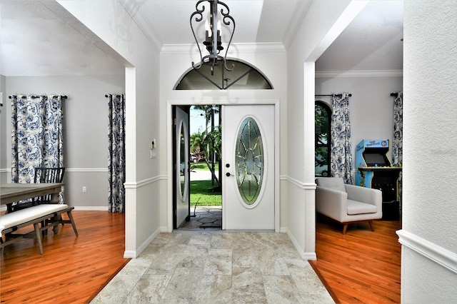 355 Trieste Dr, Punta Gorda, FL 33950 - foyer entrance with a chandelier, ornamental molding, and wood finished floors