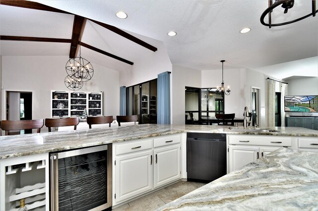 355 Trieste Dr, Punta Gorda, FL 33950 - kitchen with wine cooler, dishwashing machine, a chandelier, light stone counters, and white cabinetry