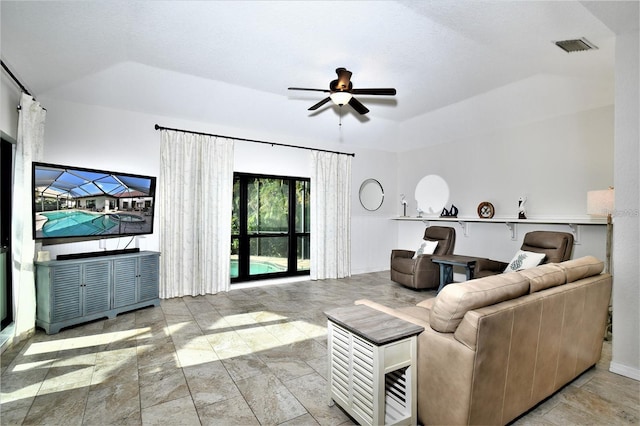 355 Trieste Dr, Punta Gorda, FL 33950 - living area with a ceiling fan, a raised ceiling, and stone finish floors