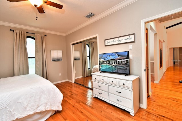 355 Trieste Dr, Punta Gorda, FL 33950 - bedroom featuring ornamental molding, light wood finished floors, ceiling fan, and a closet