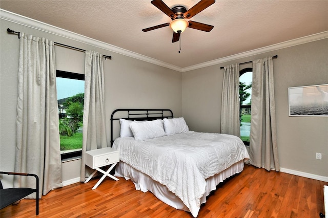 355 Trieste Dr, Punta Gorda, FL 33950 - bedroom with wood finished floors, crown molding, and a ceiling fan