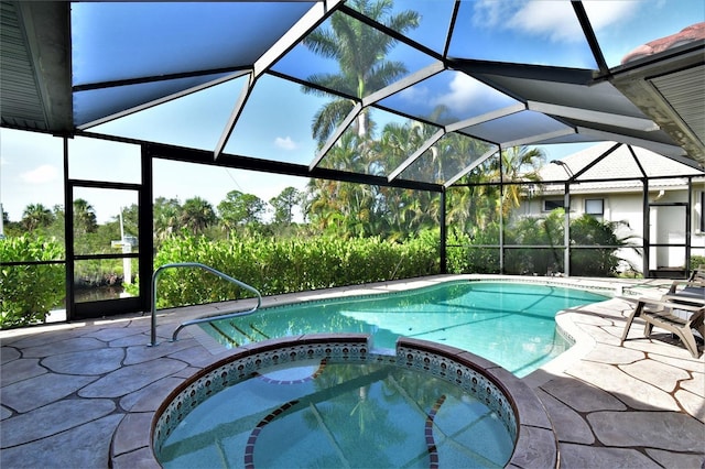 355 Trieste Dr, Punta Gorda, FL 33950 - view of swimming pool with a pool with connected hot tub, a patio area, and glass enclosure