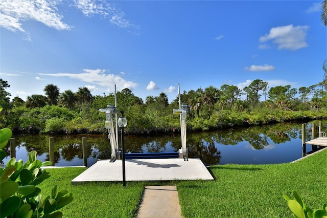 355 Trieste Dr, Punta Gorda, FL 33950 - dock area featuring a water view, boat lift, and a lawn