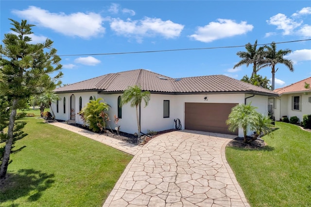 355 Trieste Dr, Punta Gorda, FL 33950 - mediterranean / spanish house with stucco siding, a tiled roof, and driveway