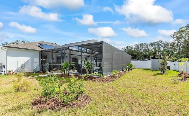 6 Pine Bluff Ln, Palm Coast, FL 32164 - back of house with a fenced backyard, a lanai, and stucco siding
