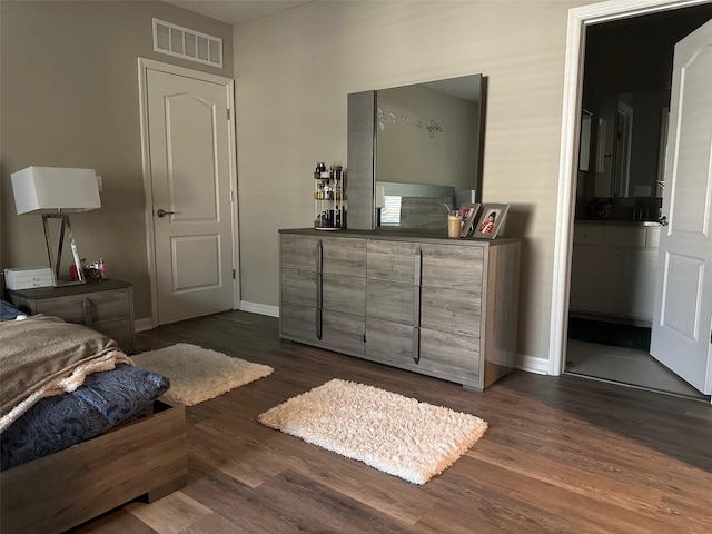6 Pine Bluff Ln, Palm Coast, FL 32164 - bedroom featuring dark wood finished floors and baseboards