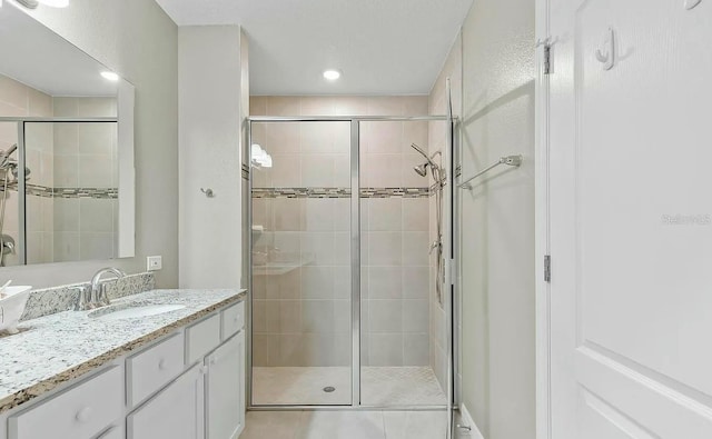 6 Pine Bluff Ln, Palm Coast, FL 32164 - full bathroom with vanity, a shower stall, and recessed lighting