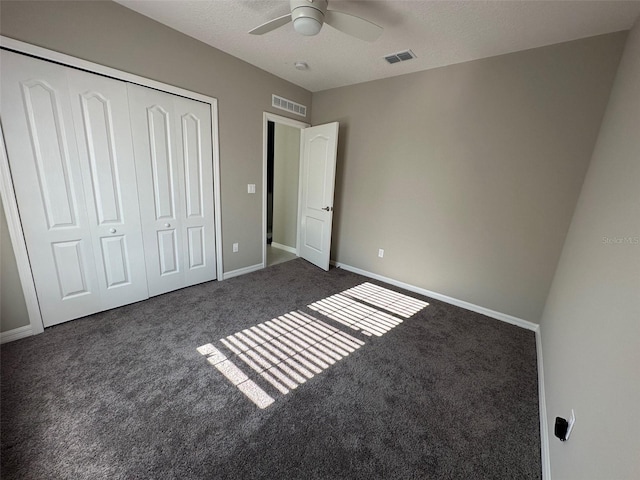 6 Pine Bluff Ln, Palm Coast, FL 32164 - unfurnished bedroom featuring carpet, a closet, and a ceiling fan