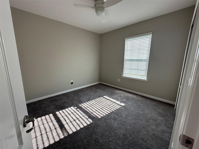 6 Pine Bluff Ln, Palm Coast, FL 32164 - empty room featuring dark colored carpet, a ceiling fan, and a textured ceiling