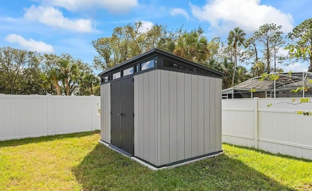 6 Pine Bluff Ln, Palm Coast, FL 32164 - view of shed featuring a fenced backyard