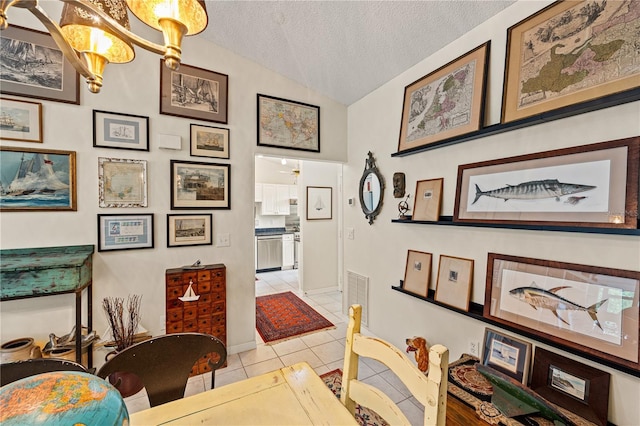 4509 Park Lake Ter N Unit 4509, Bradenton, FL 34209 - dining area with vaulted ceiling, light tile patterned floors, and a textured ceiling