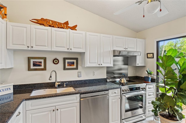 4509 Park Lake Ter N Unit 4509, Bradenton, FL 34209 - kitchen featuring appliances with stainless steel finishes, lofted ceiling, under cabinet range hood, white cabinets, and dark stone counters