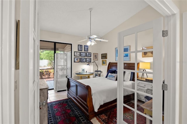 4509 Park Lake Ter N Unit 4509, Bradenton, FL 34209 - bedroom with access to exterior, vaulted ceiling, and light tile patterned floors