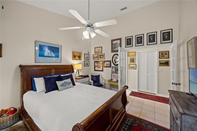4509 Park Lake Ter N Unit 4509, Bradenton, FL 34209 - bedroom featuring tile patterned flooring, a high ceiling, and a ceiling fan