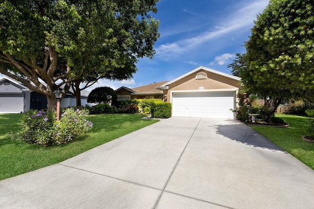 6115 68th Dr E, Palmetto, FL 34221 - single story home featuring concrete driveway, a garage, a front yard, and stucco siding