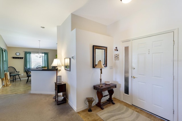 6115 68th Dr E, Palmetto, FL 34221 - entryway featuring a chandelier and wood finished floors