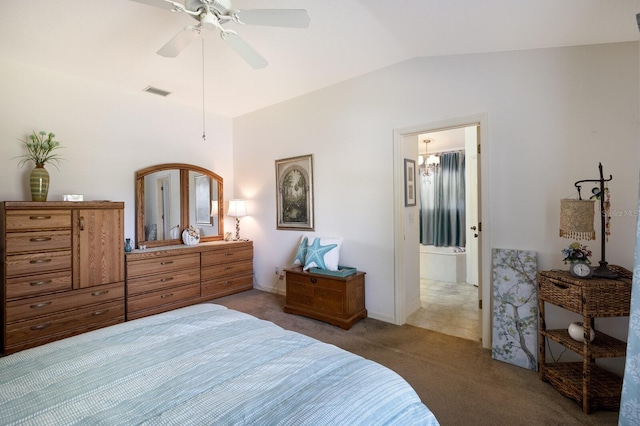6115 68th Dr E, Palmetto, FL 34221 - carpeted bedroom featuring vaulted ceiling, ensuite bath, and ceiling fan