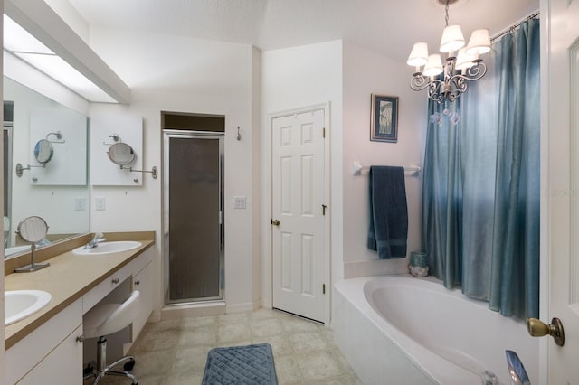 6115 68th Dr E, Palmetto, FL 34221 - bathroom featuring a stall shower, a chandelier, a garden tub, and double vanity