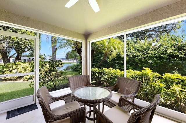 6115 68th Dr E, Palmetto, FL 34221 - sunroom / solarium with ceiling fan, a water view, a textured wall, and vaulted ceiling