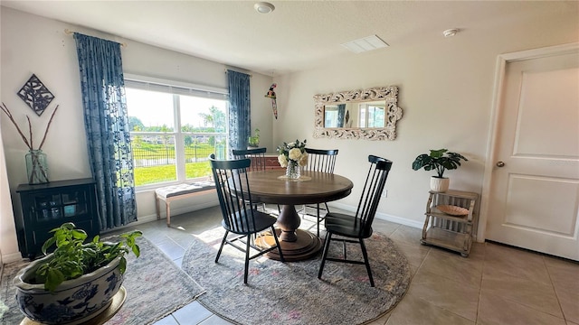 12293 Mountain Island Trl, Parrish, FL 34219 - tiled dining area with baseboards