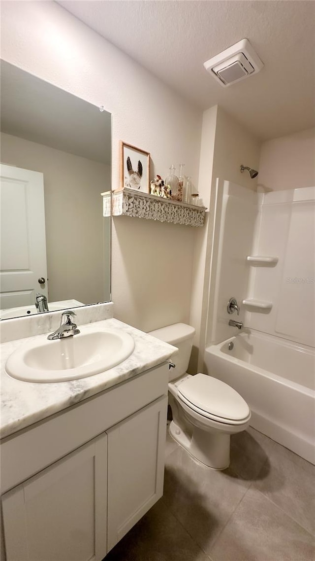 12293 Mountain Island Trl, Parrish, FL 34219 - bathroom with vanity, tile patterned floors, shower / tub combination, and a textured ceiling
