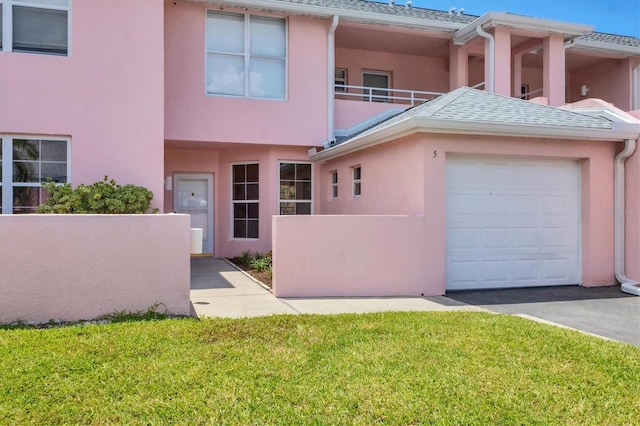 4050 Pinebrook Cir Unit 5, Bradenton, FL 34209 - view of front of home with stucco siding, a front lawn, and an attached garage