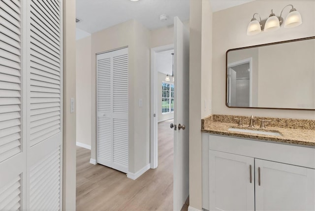 4050 Pinebrook Cir Unit 5, Bradenton, FL 34209 - bathroom featuring a closet, wood finished floors, and vanity