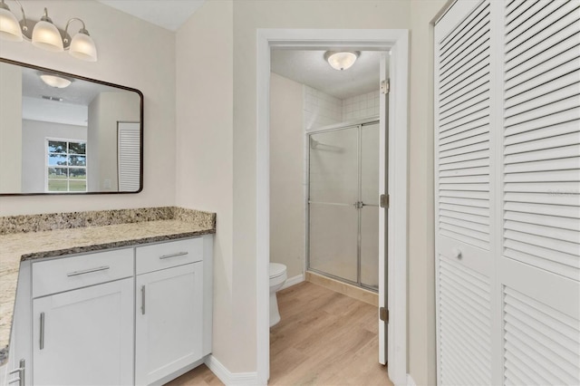 4050 Pinebrook Cir Unit 5, Bradenton, FL 34209 - full bath with a closet, a stall shower, vanity, and wood finished floors