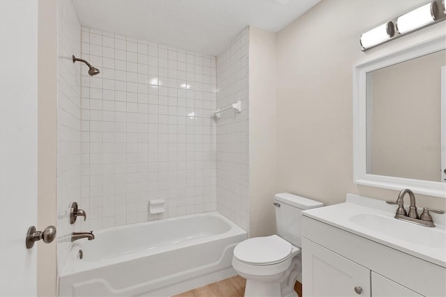 4050 Pinebrook Cir Unit 5, Bradenton, FL 34209 - bathroom with vanity, shower / washtub combination, and wood finished floors