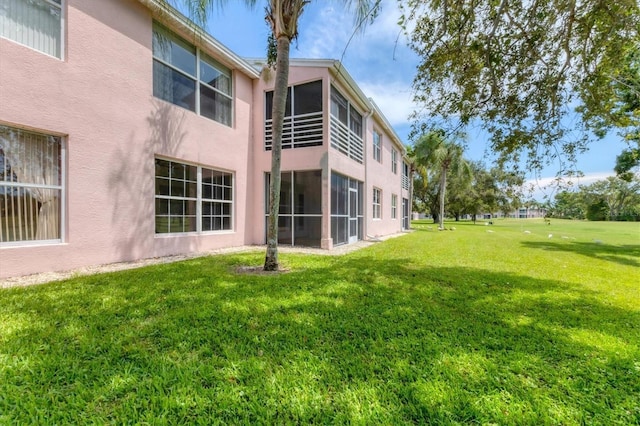 4050 Pinebrook Cir Unit 5, Bradenton, FL 34209 - view of green lawn with a sunroom