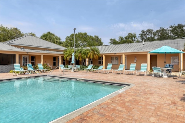 4050 Pinebrook Cir Unit 5, Bradenton, FL 34209 - community pool featuring a patio