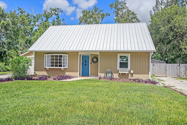 626 Hand Ave, Sarasota, FL 34232 - view of front of property with a front lawn and a metal roof