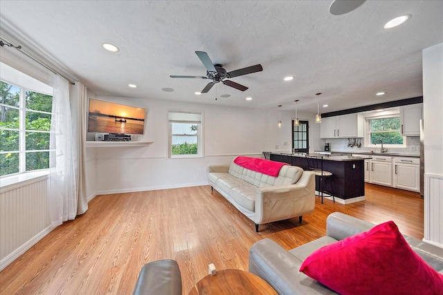 626 Hand Ave, Sarasota, FL 34232 - living room featuring healthy amount of natural light, ceiling fan, light wood-style flooring, and recessed lighting