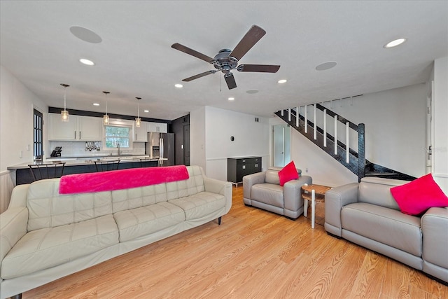 626 Hand Ave, Sarasota, FL 34232 - living area with light wood-style floors, recessed lighting, stairway, and ceiling fan