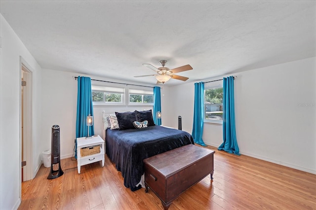 626 Hand Ave, Sarasota, FL 34232 - bedroom featuring light wood finished floors, multiple windows, and ceiling fan