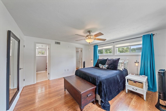 626 Hand Ave, Sarasota, FL 34232 - bedroom featuring light wood-type flooring, ceiling fan, and ensuite bath
