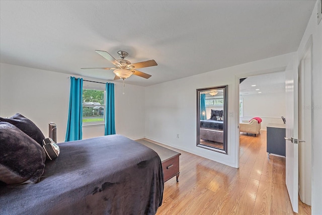 626 Hand Ave, Sarasota, FL 34232 - bedroom with light wood finished floors and a ceiling fan