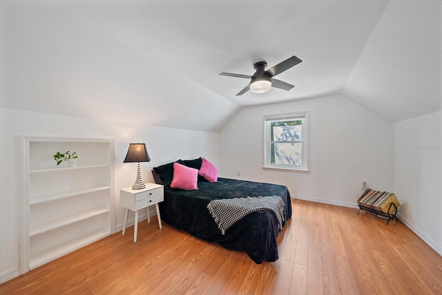 626 Hand Ave, Sarasota, FL 34232 - bedroom with light wood-style flooring, vaulted ceiling, and ceiling fan