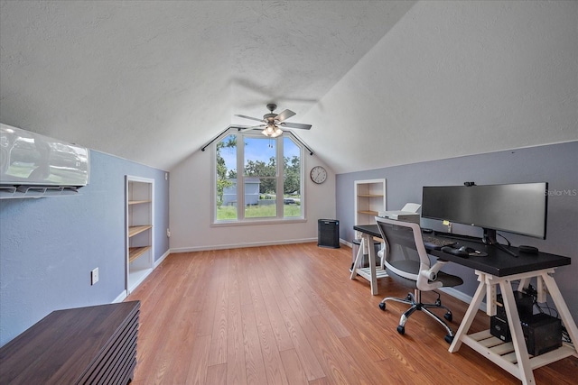 626 Hand Ave, Sarasota, FL 34232 - office space with built in features, a textured ceiling, a ceiling fan, wood finished floors, and vaulted ceiling