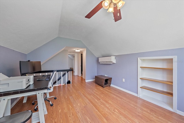 626 Hand Ave, Sarasota, FL 34232 - office featuring a wall unit AC, wood finished floors, a ceiling fan, lofted ceiling, and built in shelves