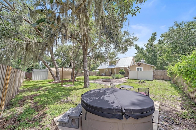 626 Hand Ave, Sarasota, FL 34232 - fenced backyard featuring a hot tub and a shed