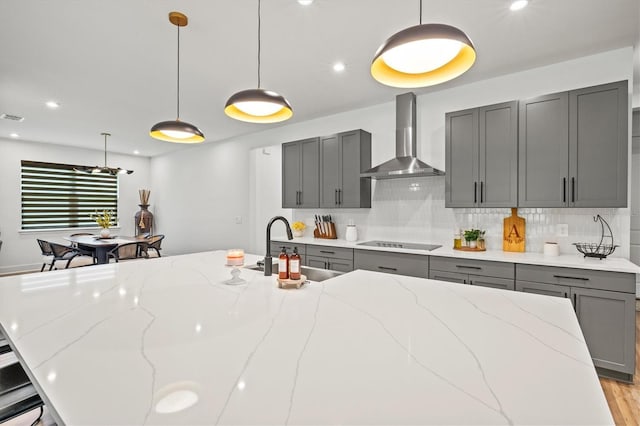 5318 124th Ave E, Parrish, FL 34219 - kitchen with gray cabinets, tasteful backsplash, light stone countertops, and recessed lighting