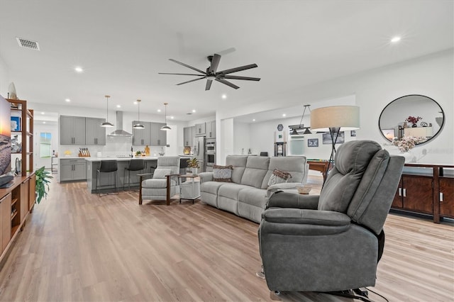 5318 124th Ave E, Parrish, FL 34219 - living area featuring light wood-style floors, a ceiling fan, and recessed lighting
