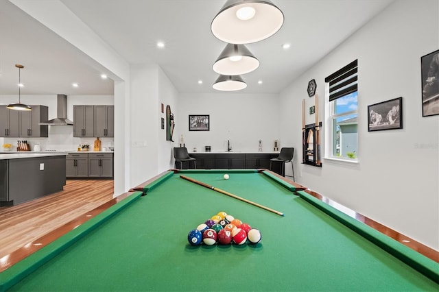 5318 124th Ave E, Parrish, FL 34219 - playroom with billiards, bar with sink, recessed lighting, and light wood finished floors