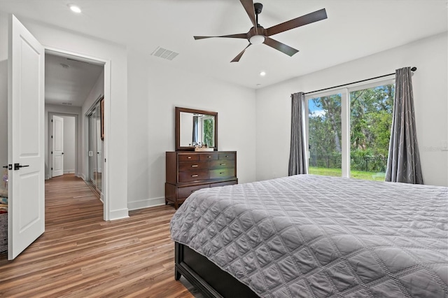 5318 124th Ave E, Parrish, FL 34219 - bedroom featuring wood finished floors, recessed lighting, access to exterior, and ceiling fan