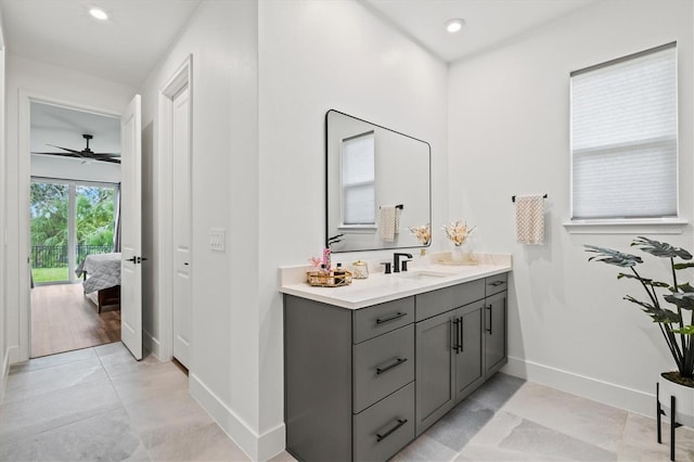 5318 124th Ave E, Parrish, FL 34219 - bathroom featuring vanity, connected bathroom, recessed lighting, tile patterned flooring, and a ceiling fan