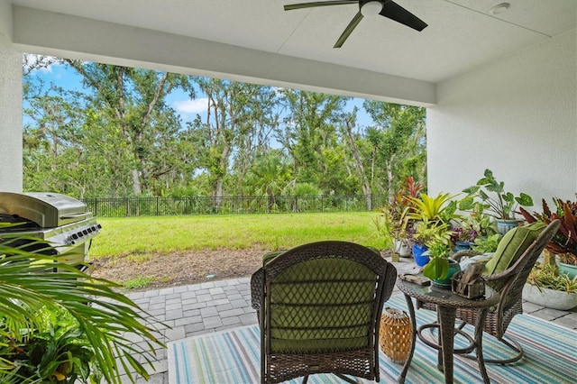 5318 124th Ave E, Parrish, FL 34219 - fenced backyard featuring a ceiling fan, a grill, a patio, and view of scattered trees