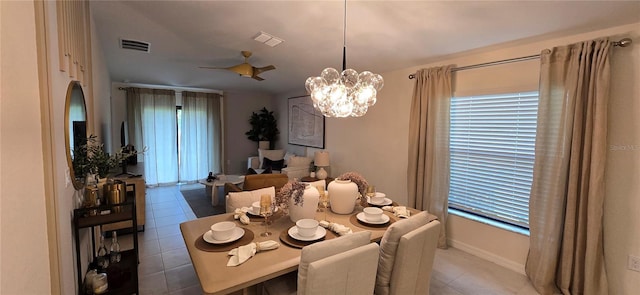 9084 Tequila Sunrise Dr, Sarasota, FL 34241 - tiled dining room featuring a chandelier and baseboards